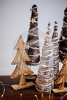 Wooden christmas trees on table.