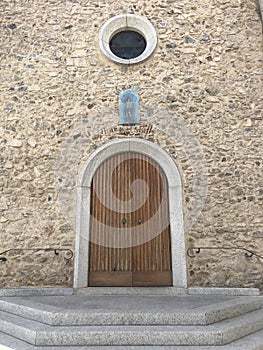 Wooden church door in an old brick church