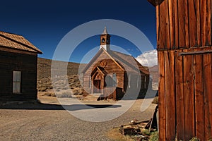 Wooden church in ghost town Bodie with blues sky