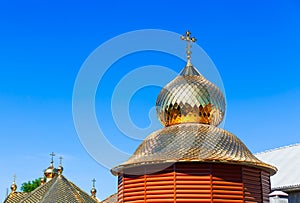 Wooden church with golden cupola