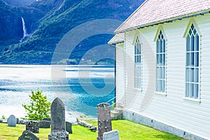 Wooden church in Nes village at fjord, Norway