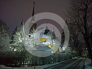 Wooden church at night in the winter time. Biserica Spitalului Giurgiu. photo