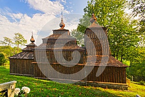 Wooden church of Saint Michael the Archangel in Prikra during summer sunset