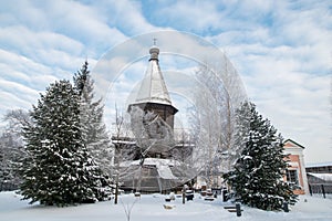 Wooden church and tree
