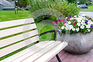 wooden city bench and flower bed, nobody