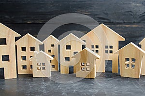 Wooden city and houses. concept of rising prices for housing or rent. Growing demand for housing and real estate.