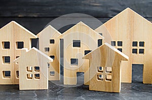 Wooden city and houses. concept of rising prices for housing or rent. Growing demand for housing and real estate.