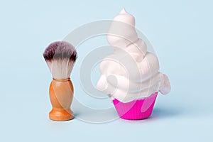 Wooden classic shaving brush with foam in cupcake, Treatment for bodycare, funny concept of hair remove, minimal creative idea for