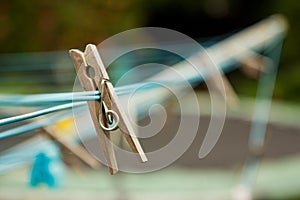 Wooden clothes peg on a washing line