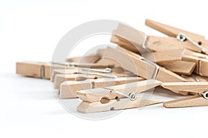 Wooden clothes pins, isolated on a white background