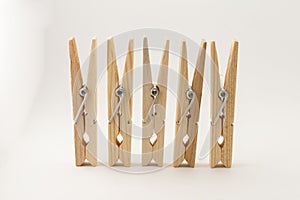 Wooden clothes pins in lightbox