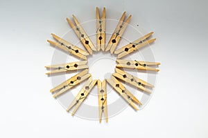 Wooden clothespins on a white background