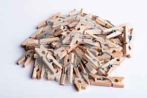 Wooden clothespins on white background