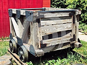 A wooden coal cart inside The No.9 Coal Mine museum