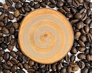 Wooden coaster copy space isolated on coffee beans background