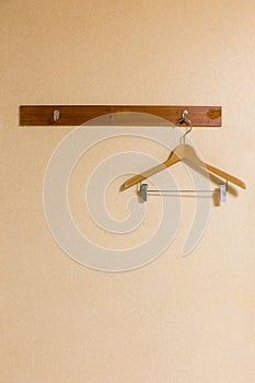 Wooden coat hanger On a wooden wall hanging