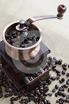 Wooden coffee grinder and coffee beans photo
