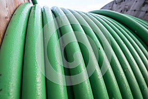 Wooden coil of wet green Electric Cable outdoor