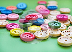 Wooden colored buttons in green background
