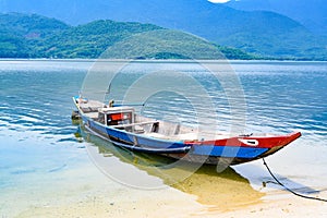 Wooden colorful dragon boat on Lap An Lagoon between Da Nang and Hue City, Vietnam