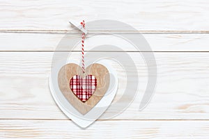 Wooden colorful heart on rope. Concept for Valentine`s Day, wedding, engagement and other romantic events. Top view, close-up,