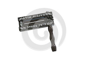 Wooden colorful noisemaker or gragger for purim celebration holiday jewish holiday isolated on white. Text in hebrew: When Adar