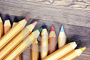 Wooden colorful ordinary pencils isolated on a white background