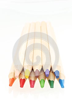 Wooden colorful pencils isolated on white