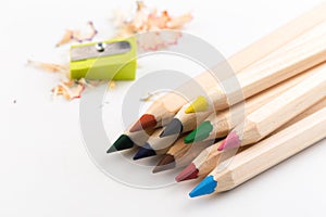 Wooden colorful pencils isolated on a white background, pencil sharpeners