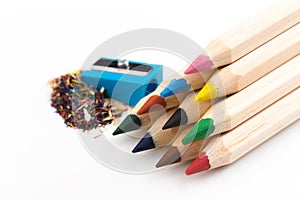 Wooden colorful pencils isolated on a white background, pencil sharpeners