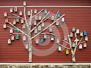 Wooden colors birdhouses on wall