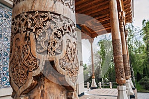 Wooden column with carved oriental pattern Uzbek ornament in Museum of Victims of Political Repression in Tashkent in photo