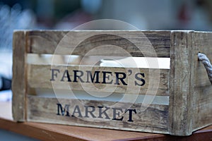 Wooden compartment labeled Farmer\'s Market