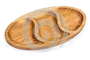 Wooden compartmental dish with three departments on a white background