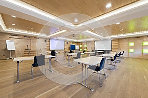 Wooden conference room with projection screens