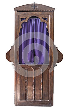 Wooden confessional, stall in which the priest hear the confessions of penitents photo