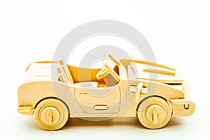 wooden construction light brown kids car on white