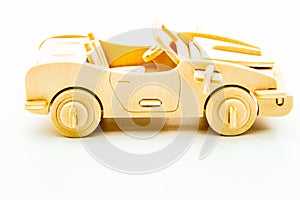 wooden construction light brown kids car on white