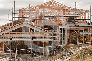 Wooden construction of private houses on uneven surfaces, building in New Zealand