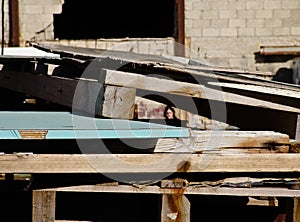 Wooden construction structures stacked in an industrial site, outside