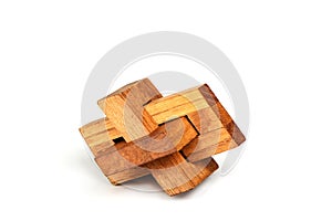Wooden constructor puzzle oblique knot over white background