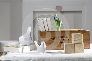 Wooden container with books,