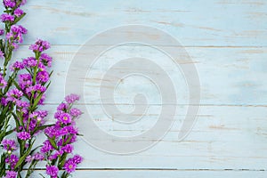 Wooden copy space with purple gerbera flower