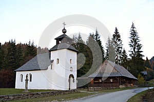 Wooden cottage with church