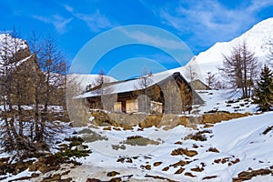 Wooden cottage Simplon Pass nice spring day Switzerland