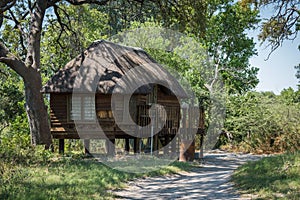 Wooden cottage on stilts with thatched roof