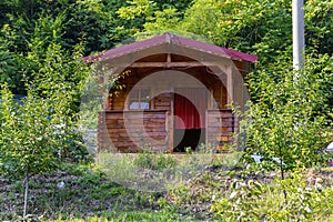 A wooden cottage in the woods background