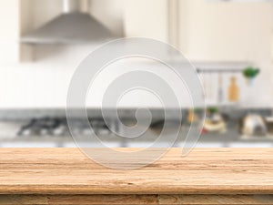 Wooden counter top with kitchen background