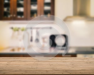 Wooden counter top with kitchen background