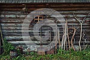 Wooden barn wall texture and farming tools photo